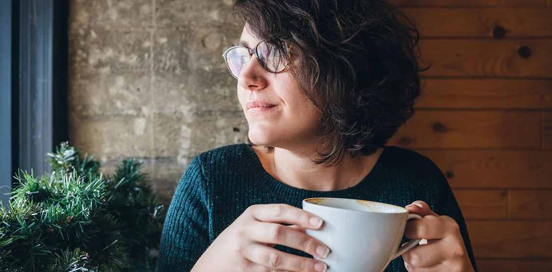 Single-woman-glasses-looking-out-window- (1)